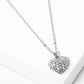 Crystal Pave Heart Pendant Necklace is crafted to bring a touch of sophistication to any outfit. Its sparkling pave crystals are timeless and elegant, while the heart-shaped pendant symbolizes love and affection. Made from high-quality materials, this necklace is designed to make a statement and elevate your style effortlessly. 