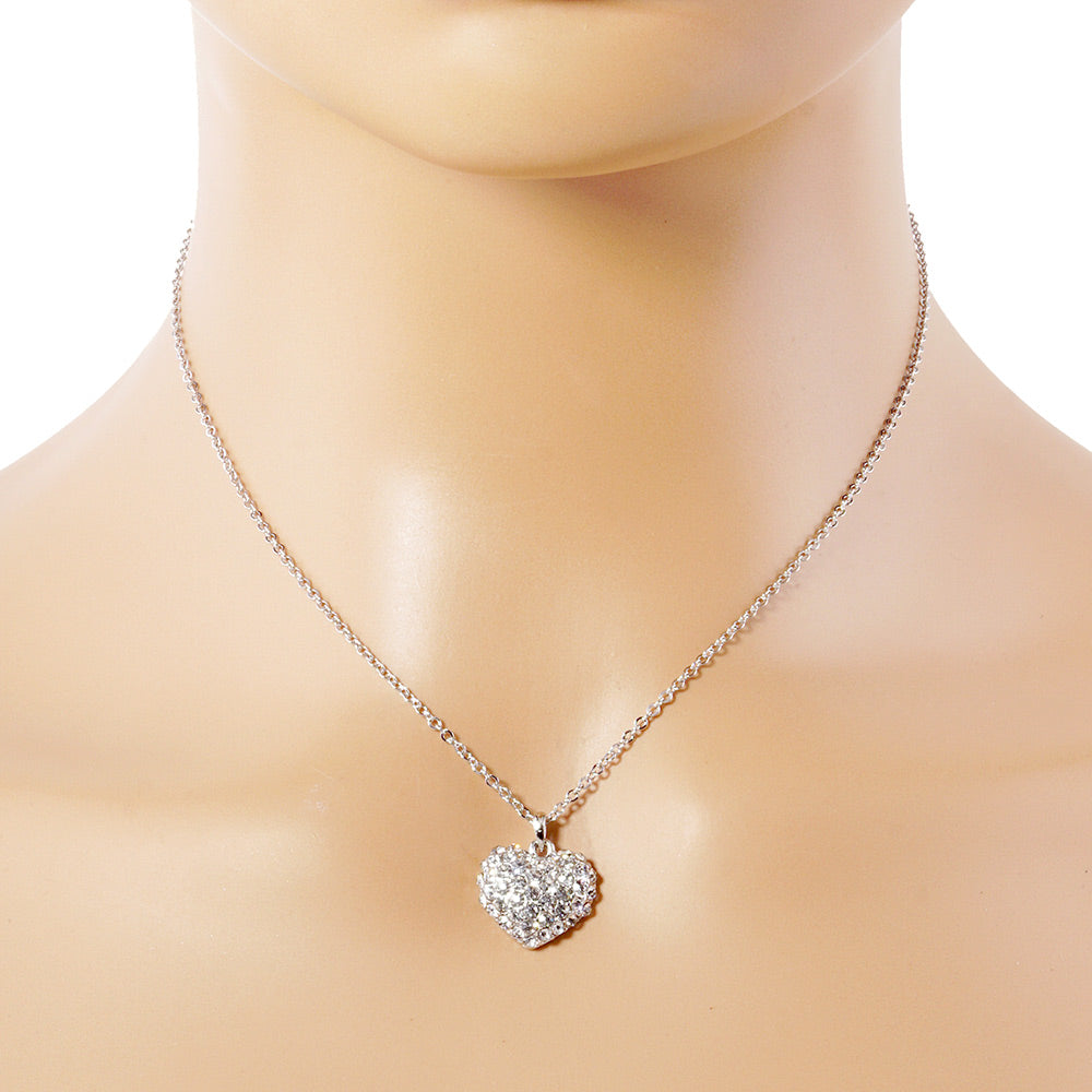 Crystal Pave Heart Pendant Necklace is crafted to bring a touch of sophistication to any outfit. Its sparkling pave crystals are timeless and elegant, while the heart-shaped pendant symbolizes love and affection. Made from high-quality materials, this necklace is designed to make a statement and elevate your style effortlessly. 