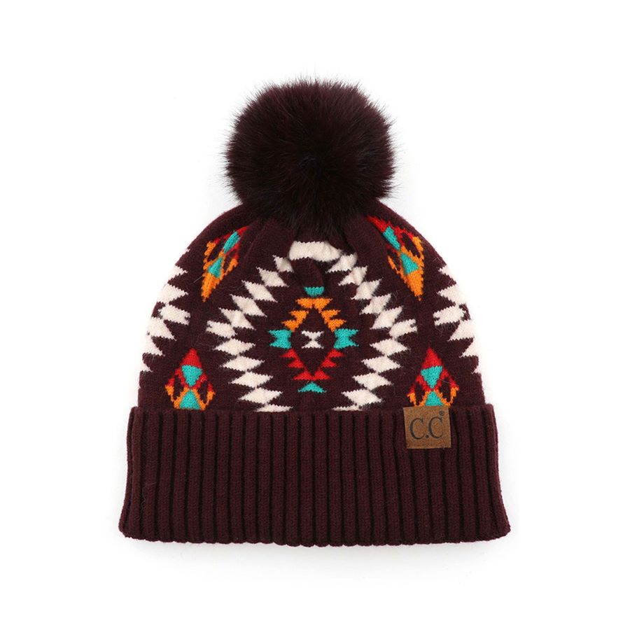 Dark Berry C.C Soft Aztec Pattern Beanie with Faux Fur Pom,&nbsp;is beautifully knitted with a variety of colors and design that brings a unique look. Coordinate these aztec pattern beannie with any outfit to match the best with absolute warmth and coziness in style. This is an ideal winter head cover that comes in one size winter cap with a faux fur pom that fits most head sizes. Perfect winter gift accessory for your friends, family, and the persons you love.