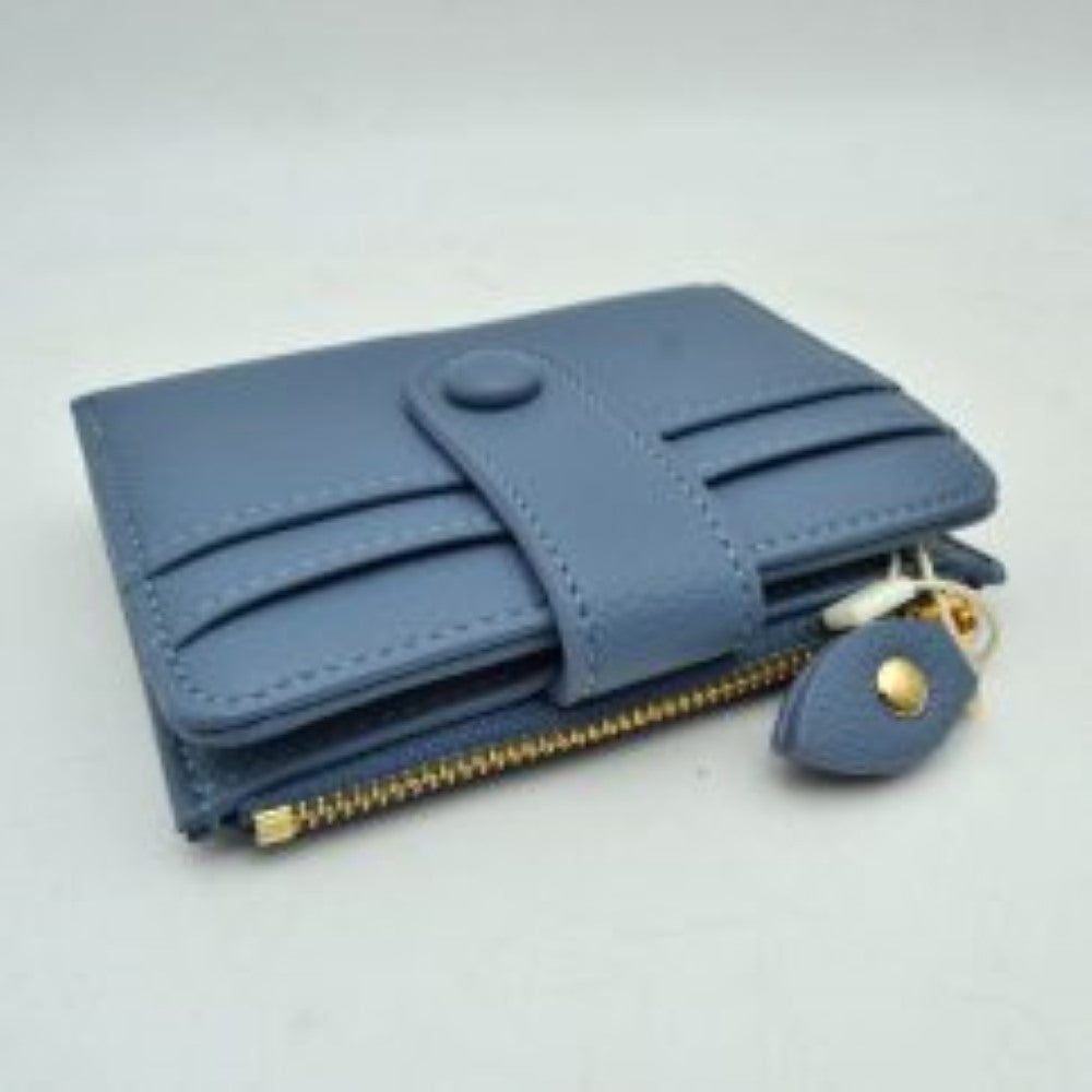 Dark-blue This compact card holder wallet features a textured pebbled exterior in a soft beige tone, providing a sleek and practical design for daily organization. The front panel is equipped with multiple exterior card slots secured by a matching leather strap with a snap button closure. A secure side pocket with a metallic gold-tone zipper and a detailed leather pull tab opens to an internal compartment for coins or folded bills, making it an essential companion for minimalist carrying.