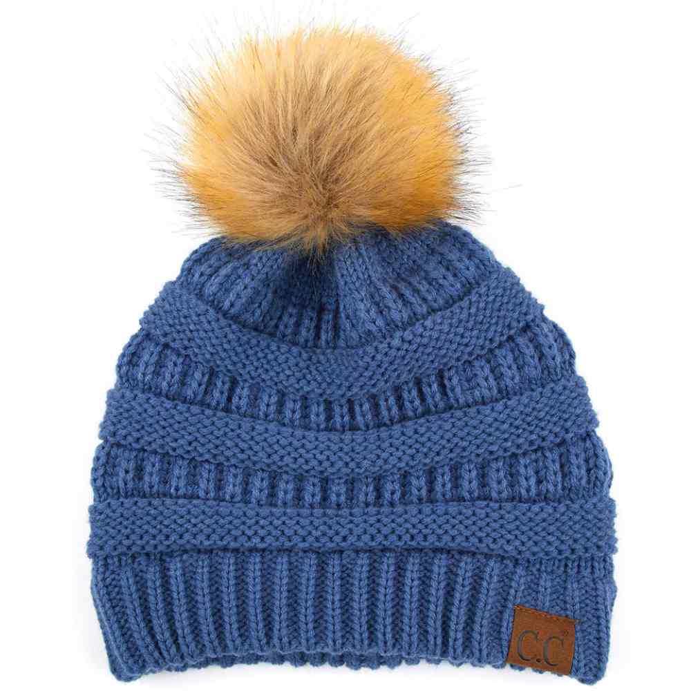 Dark Denim Stay warm and cozy with this classic C.C Pom Pom Knit Beanie, crafted from 100% soft acrylic for all-day comfort. The ribbed knit design adds texture and durability, while the signature pom pom on top brings a playful touch to any winter outfit. One size fits most, making it the perfect accessory for everyone. Ideal for cold weather adventures or casual everyday wear.