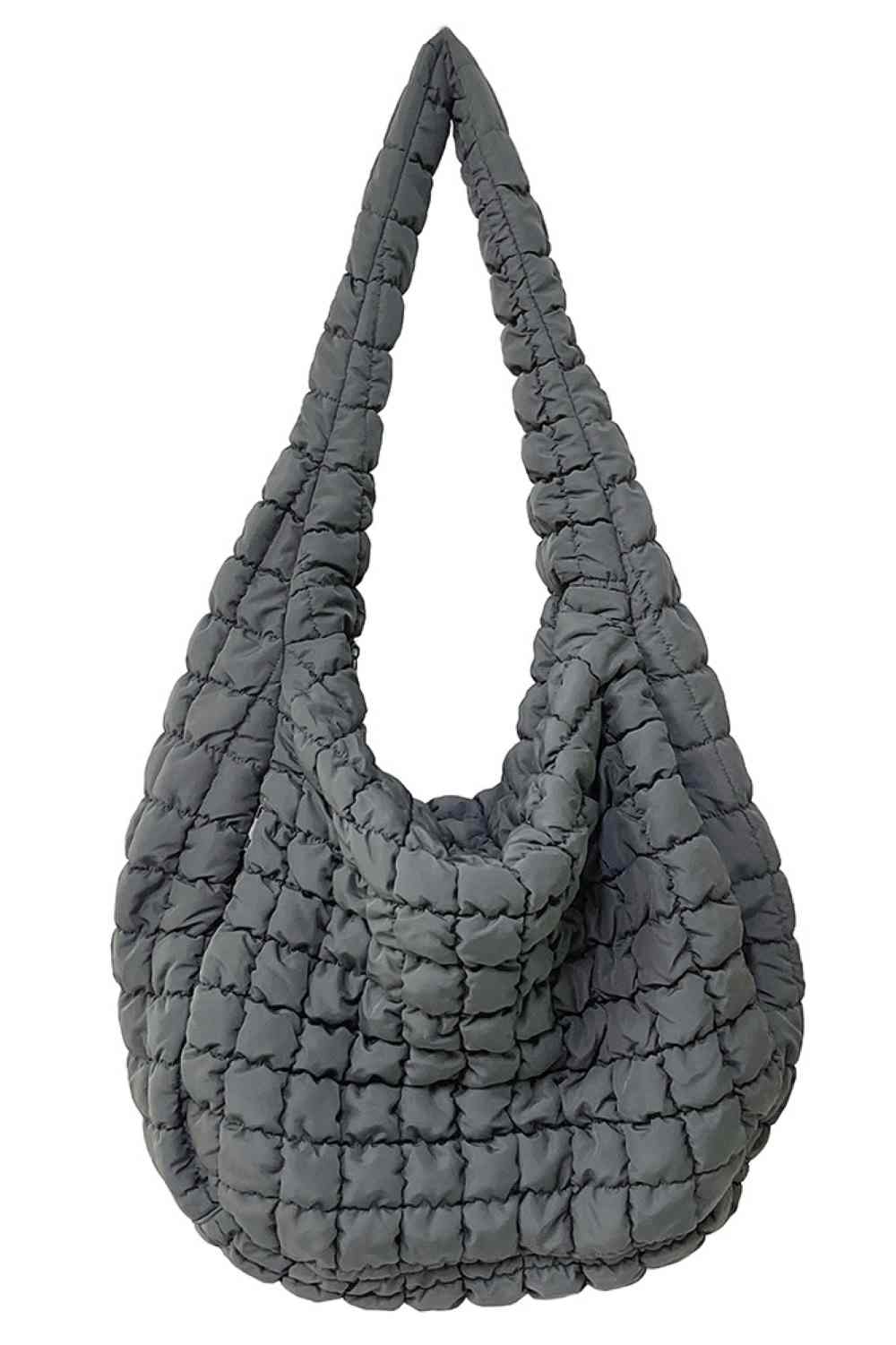 Dark Gray Spacious quilted bag designed for everyday carry and travel. Features a durable 100% polyester construction with a quilted exterior for added protection and style. Generous dimensions of 17.7" x 19.7" x 8.7" provide ample room for essentials, making it perfect for shopping, work, or weekend getaways. Lightweight and easy to maintain. Made in China.