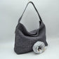 Dark-grey This slouchy hobo bag showcases a textured woven pattern across its exterior, offering a refined look that is perfect for everyday use. The spacious main compartment provides ample storage for daily essentials, featuring a relaxed silhouette with a flat top shoulder strap for comfortable carrying. A separate, detachable secondary strap with metallic clasps is included, allowing for versatile styling options to suit your needs.