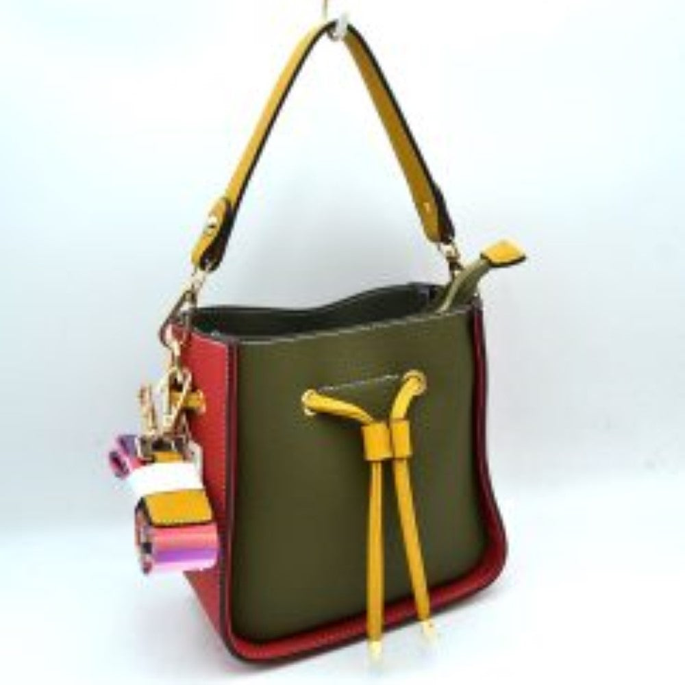 Dark-green This stylish bucket bag features a distinctive color-blocked design crafted with a pebbled exterior texture, making it a versatile accessory for everyday use. The front panel includes a classic cinch drawstring closure detailed with contrasting trim and polished metallic aglets that open to a secure main storage compartment. Built for flexibility, it is equipped with a structured shoulder handle, an adjustable long shoulder strap