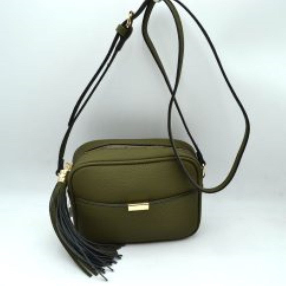Dark green This sophisticated crossbody bag features a structured camera-bag silhouette crafted from a textured pebbled faux leather in a neutral beige tone, making it a versatile addition to any wardrobe. The clean-lined front is detailed with a subtle open slip pocket highlighted by a polished, gold-tone metal hardware accent at the center. Secured by a smooth top-zipper closure, the bag is finished with an adjustable shoulder strap and a dramatic