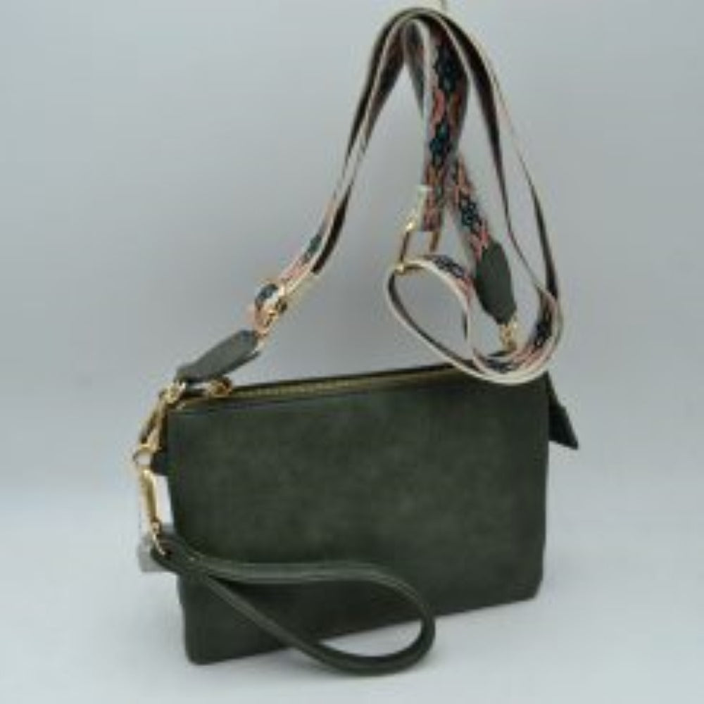 Dark green This versatile clutch is designed for seamless everyday transition and features multiple carrying options to suit your style. It is equipped with secure top zipper compartments to keep your daily essentials safely organized and within reach. For carrying flexibility, the bag comes with both a matching wristlet loop and a wide, adjustable shoulder strap decorated with a detailed geometric woven pattern, both attaching easily via sturdy metallic clasps.
