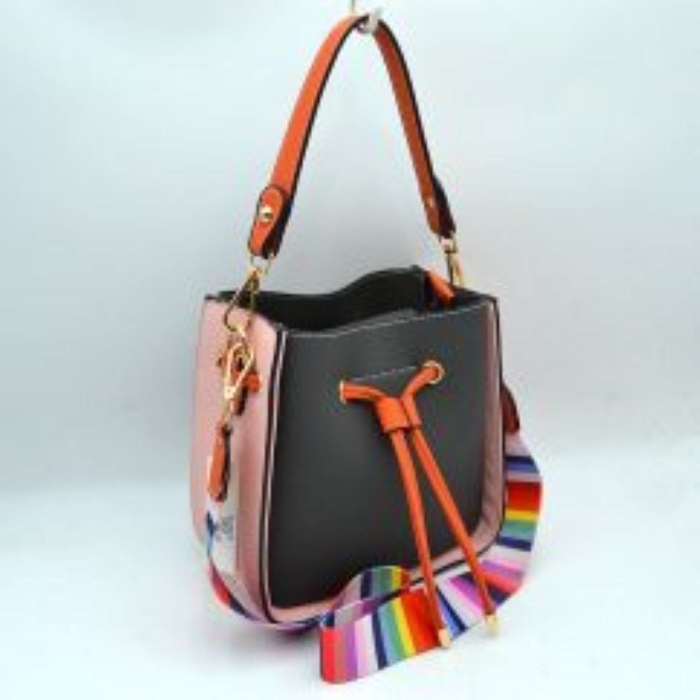 Dark-Grey This stylish bucket bag features a distinctive color-blocked design crafted with a pebbled exterior texture, making it a versatile accessory for everyday use. The front panel includes a classic cinch drawstring closure detailed with contrasting trim and polished metallic aglets that open to a secure main storage compartment. Built for flexibility, it is equipped with a structured shoulder handle, an adjustable long shoulder strap