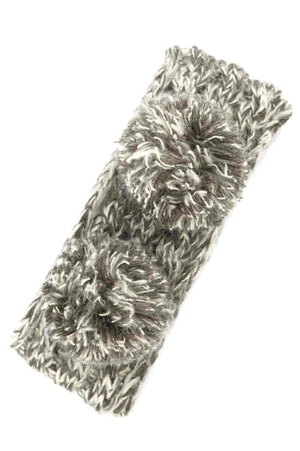 Dark Grey Cozy two-tone kids head wrap featuring a soft fuzzy lining for extra warmth and comfort. Double pom-pom design adds playful style perfect for cold weather. Crafted from 100% acrylic for durability and easy care. One size fits most children. A practical accessory that keeps little ones warm while looking adorable.