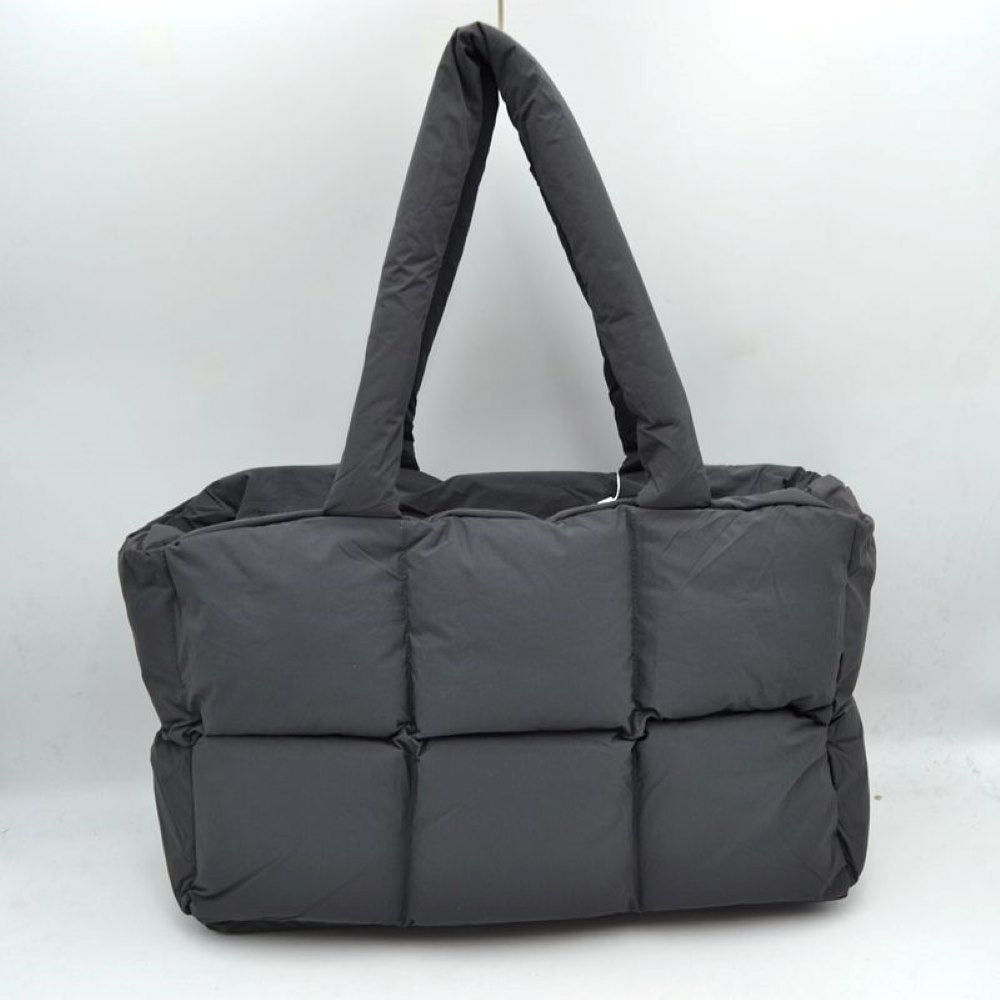 Dark Grey Meet your new go-to everyday companion with this Chic Quilted Puffer Tote Bag. This oversized puffer tote perfectly blends streetwear style with practical, lightweight functionality, making it ideal for travel, work, gym gear, or daily errands.