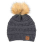 Dark grey Stay warm and cozy with this classic C.C Pom Pom Knit Beanie, crafted from 100% soft acrylic for all-day comfort. The ribbed knit design adds texture and durability, while the signature pom pom on top brings a playful touch to any winter outfit. One size fits most, making it the perfect accessory for everyone. Ideal for cold weather adventures or casual everyday wear.