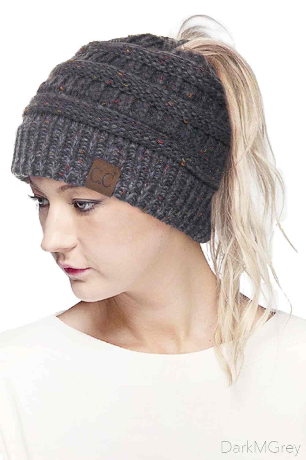 Dark Grey Stay cozy and stylish with the C.C Ombre Confetti Messy Bun Ponytail Beanie. Crafted from 100% acrylic, this versatile beanie features a trendy messy bun opening that lets you wear your hair down while staying warm. The soft, stretchy fabric provides all-day comfort and durability, making it perfect for casual outings or outdoor adventures.&nbsp;