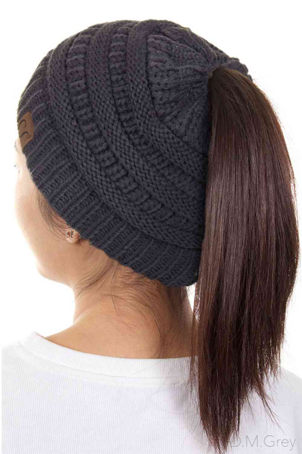 Dark Grey The C.C Solid Color Ponytail Messy Bun Beanie combines comfort with versatility for effortless everyday style. Crafted from 100% soft acrylic, this beanie features an open crown design that accommodates ponytails and messy buns while keeping you warm. The one-size-fits-most construction ensures a secure, flattering fit for virtually anyone. Perfect for casual outings, workouts, or relaxed weekends, this practical accessory transitions seamlessly from season to season.