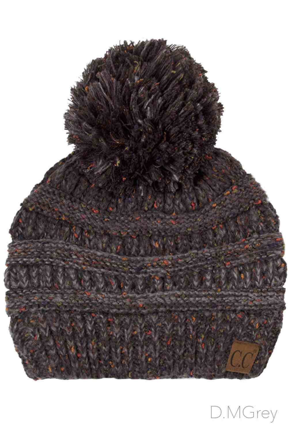 Dark Grey Wrap yourself in cozy style with the C.C Ombre Beanie with Pom Pom. Made from 100% soft acrylic, this lightweight knit delivers warmth without the weight, making it ideal for layering or standalone wear.
