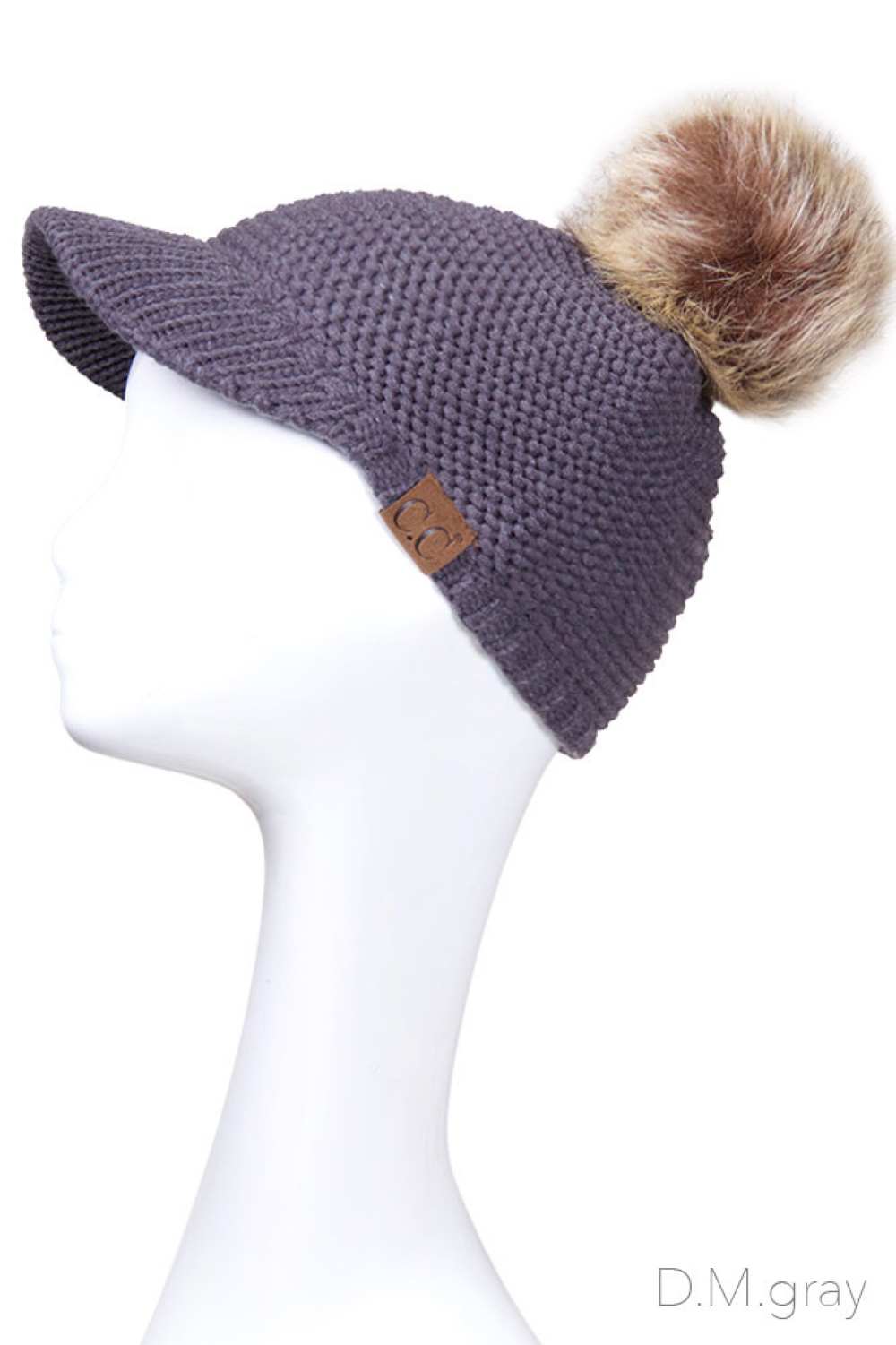 Dark Grey Elevate your winter wardrobe with this versatile C.C knit brim beanie, crafted from 100% soft acrylic for exceptional comfort and durability. The signature knitted brim design pairs beautifully with a plush fur pom pom, adding a touch of sophistication to any cold-weather look. One size fits most, making it an effortless accessory choice for anyone seeking warmth without compromising on style. Perfect for layering or standalone wear, this beanie delivers both functionality and fashion