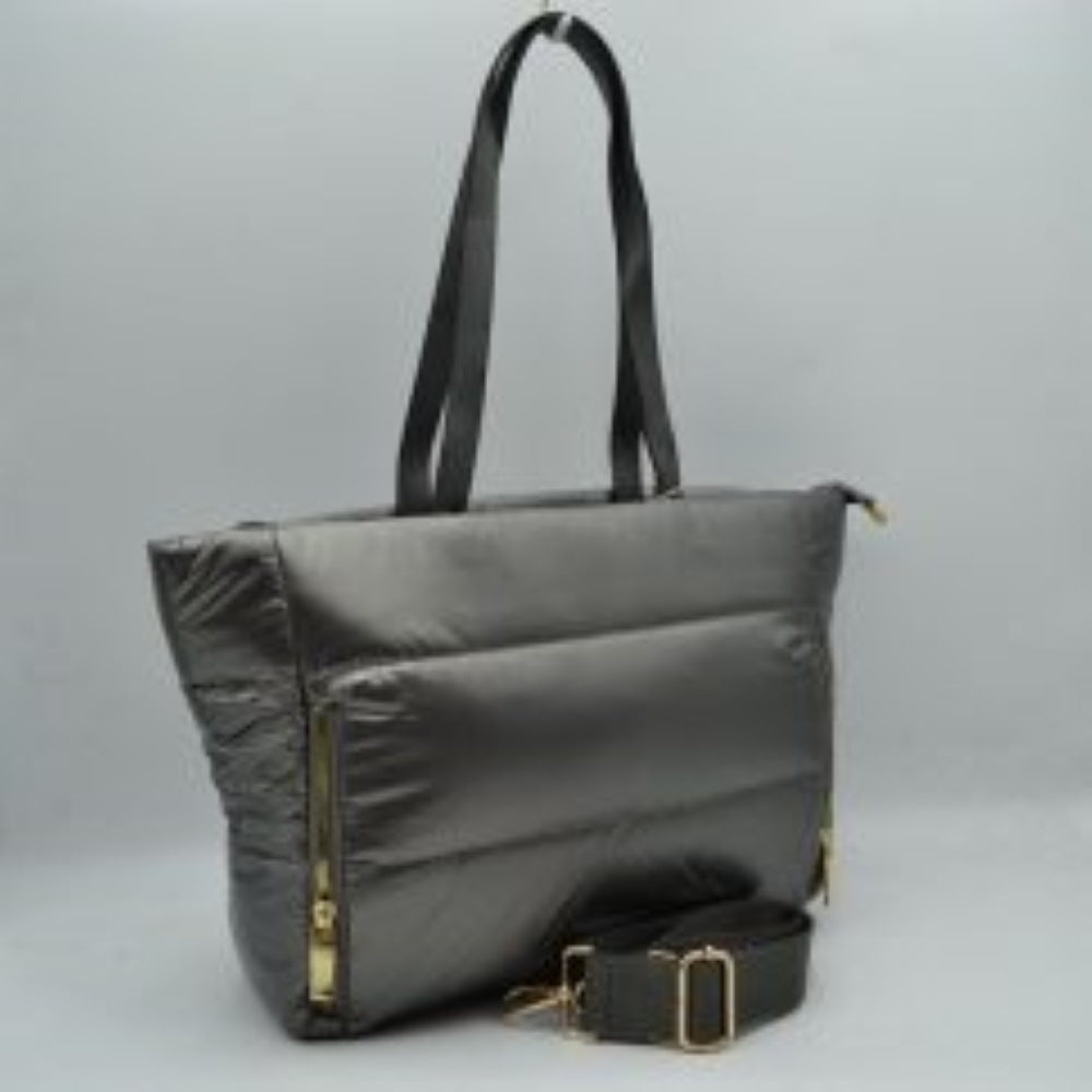 Dark-Silver This versatile tote bag features a modern puffer design with horizontal quilted panels and a sleek satin-like finish, making it a stylish choice for everyday organization. It is equipped with dual flat shoulder handles for comfortable carrying, alongside a secondary adjustable fabric crossbody strap attached with metallic gold-tone hardware. The main storage compartment secures with a full top zipper closure