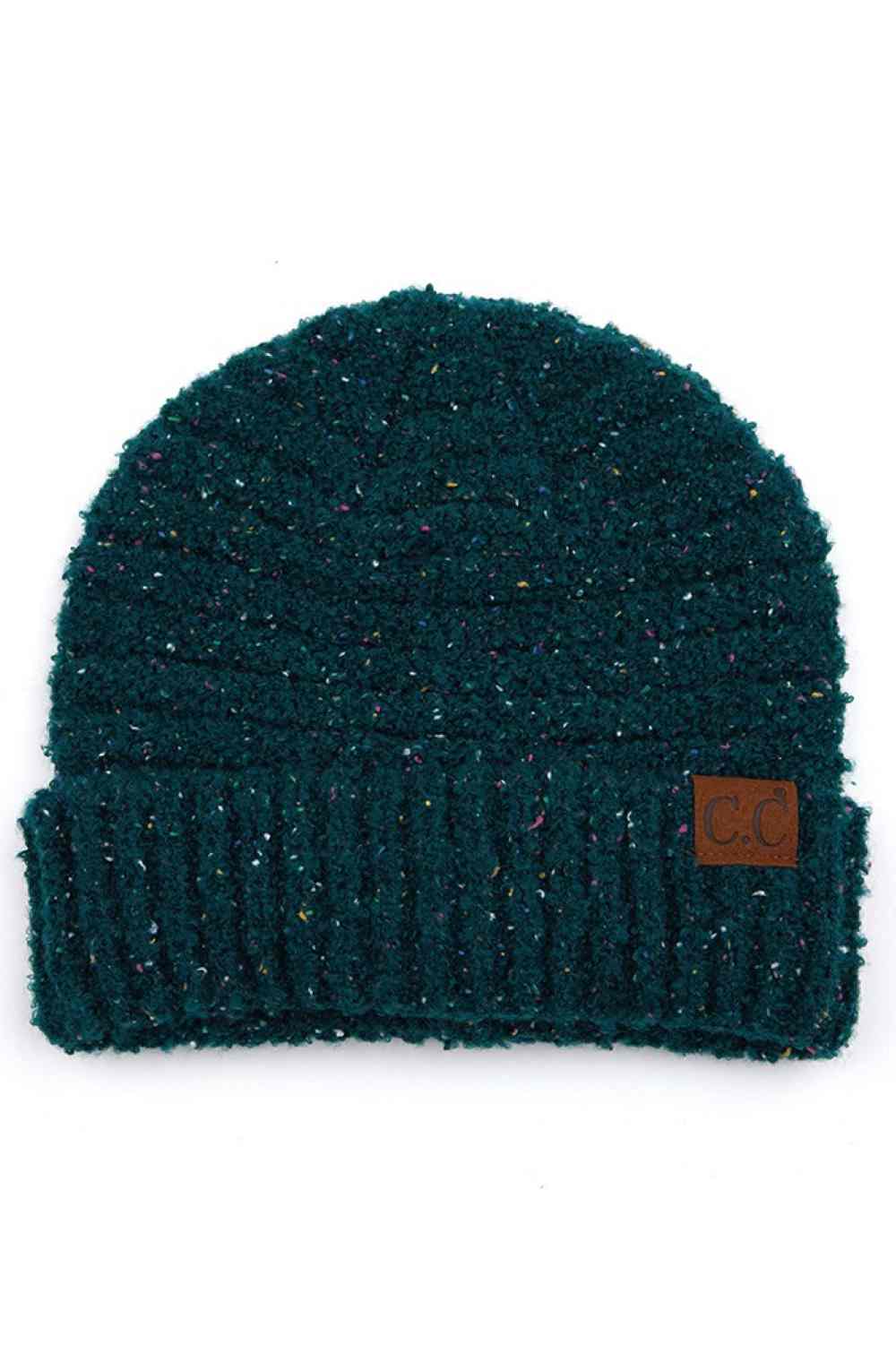 Deep Pine Elevate your winter wardrobe with this C.C Confetti Boucle Yarn Beanie, crafted from a premium blend of 95% polyester and 5% cotton. The textured boucle yarn creates visual interest and dimension, making it the perfect accessory to complement any outfit.