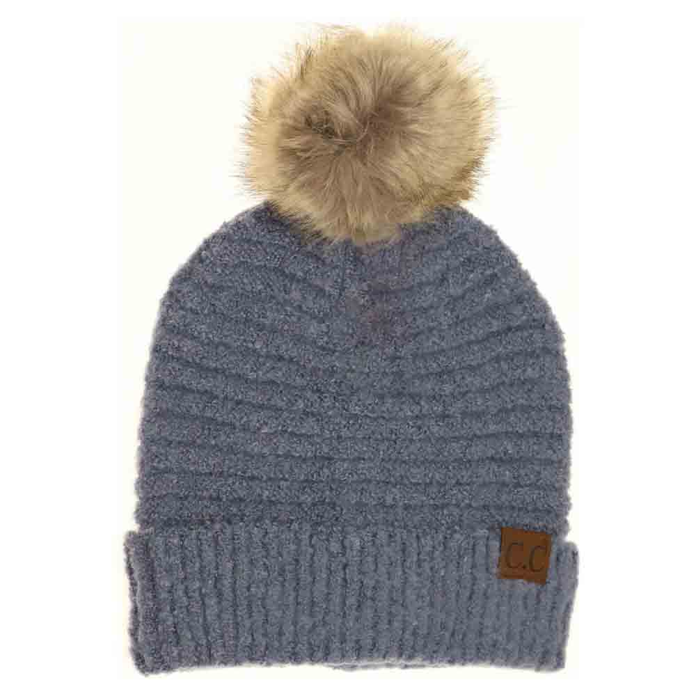 Denim Solid Boucle Knit Pom CC Beanie combines texture and warmth through its soft boucle knit fabric. Designed for expert-level comfort, this beanie features a classic silhouette topped with a playful pom for a refined yet casual look. Ideal for cold weather, it offers durable insulation while maintaining breathability, making it a versatile accessory for everyday wear. 