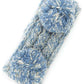 Denim Cozy two-tone kids head wrap featuring a soft fuzzy lining for extra warmth and comfort. Double pom-pom design adds playful style perfect for cold weather. Crafted from 100% acrylic for durability and easy care. One size fits most children. A practical accessory that keeps little ones warm while looking adorable.