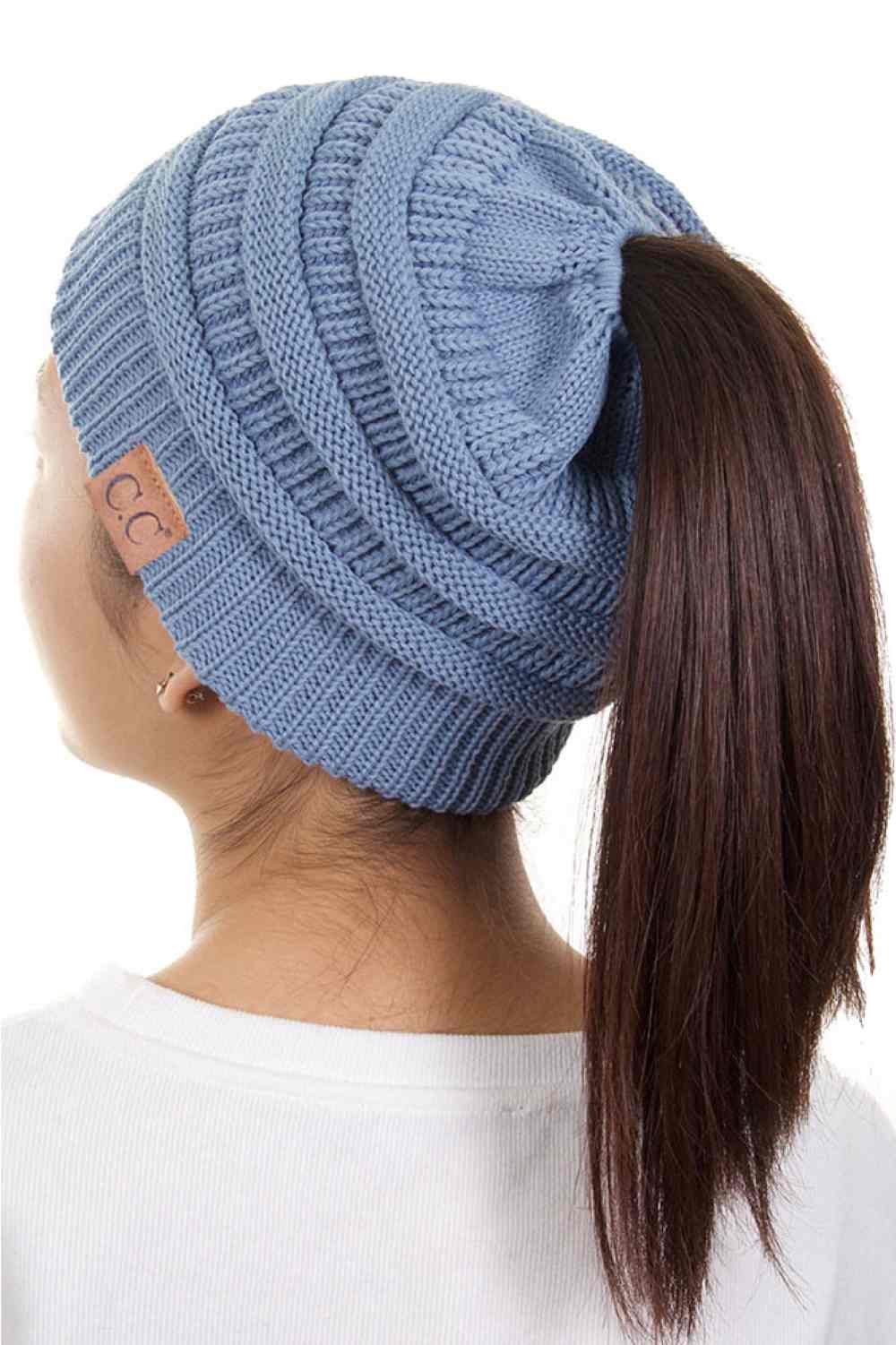 Denim The C.C Solid Color Ponytail Messy Bun Beanie combines comfort with versatility for effortless everyday style. Crafted from 100% soft acrylic, this beanie features an open crown design that accommodates ponytails and messy buns while keeping you warm. The one-size-fits-most construction ensures a secure, flattering fit for virtually anyone. Perfect for casual outings, workouts, or relaxed weekends, this practical accessory transitions seamlessly from season to season.