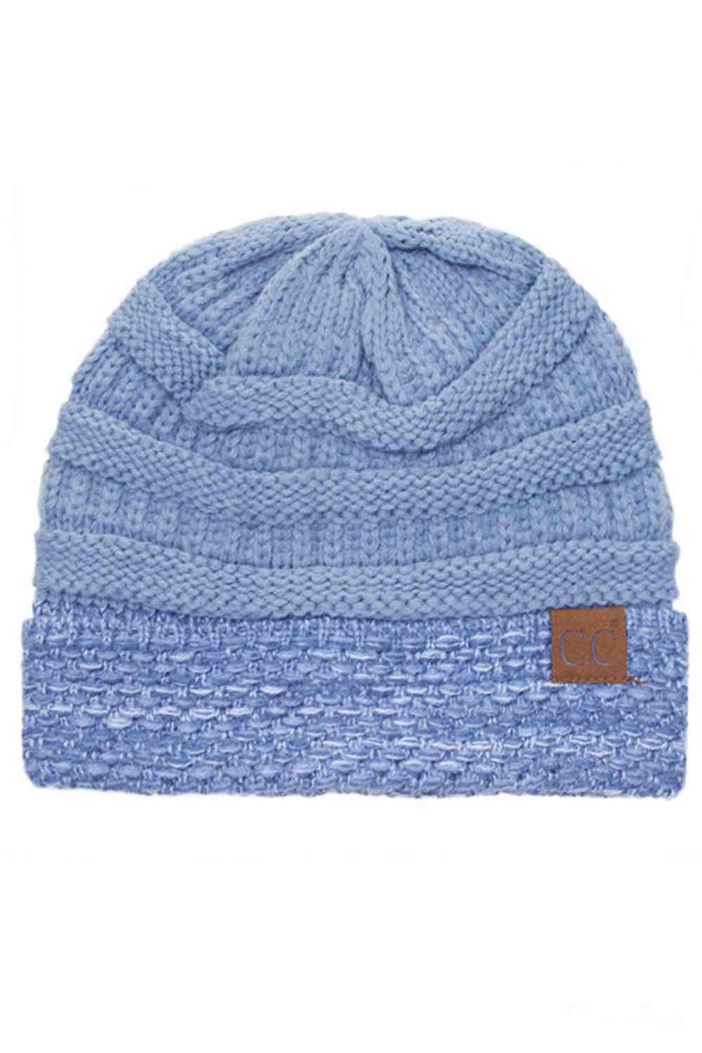 Denim The C.C Two Tone Cable Knit Beanie delivers cozy warmth with a classic aesthetic. Made from 100% acrylic, this durable beanie features a comfortable cuff design perfect for everyday wear.