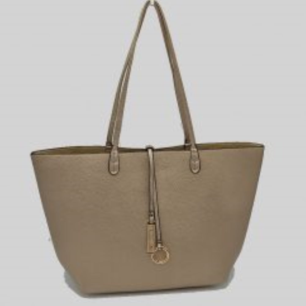 Desert-Sand This classic tote bag features a smooth exterior finish with a timeless trapeze silhouette, offering an elegant look for everyday use. Designed with an open top for quick access, the spacious main compartment provides ample storage space for daily essentials. Dual slim shoulder handles are securely stitched to the upper panels, while a decorative central drawstring tie accents the front, complete with a metallic ring and matching tab accent for a polished touch.