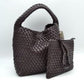 Espresso This stylish everyday hobo bag features an all-over classic basket weave design and a slouchy silhouette. It is crafted with a seamless, integrated wide top handle that transitions directly into the main storage compartment for comfortable hand or shoulder carrying.