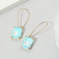 Madeline Love Blue, Light Emerald Cut Stone Dangle Evening Earrings