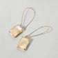 Madeline Love AB, Taupe Emerald Cut Stone Dangle Evening Earrings