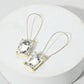 Madeline Love Clear, Gold Emerald Cut Stone Dangle Evening Earrings