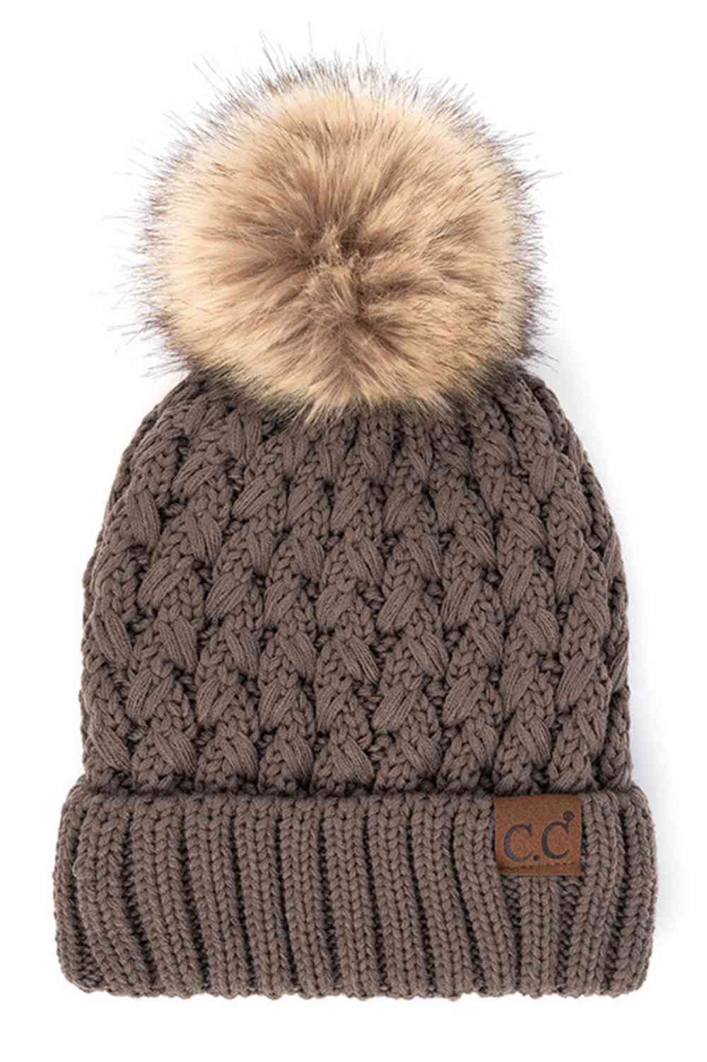 Brown Elevate your winter wardrobe with the C.C Lattice Crossover Stitch Beanie, featuring an intricate lattice pattern and cozy pom detail. Crafted from 100% soft acrylic, this beanie delivers warmth and comfort without the weight. The crossover stitch design adds visual interest while the relaxed fit suits most face shapes. Perfect for layering over your favorite winter looks, this versatile beanie transitions effortlessly from casual outings to outdoor adventures. One size fits most for easy, everyday we