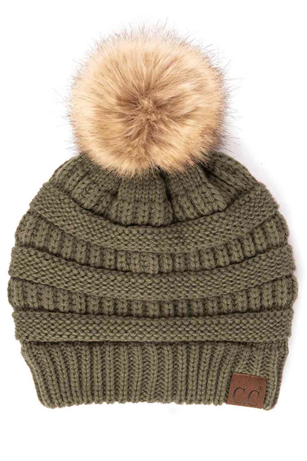 Earth Grey Stay warm and cozy with this classic C.C Pom Pom Knit Beanie, crafted from 100% soft acrylic for all-day comfort. The ribbed knit design adds texture and durability, while the signature pom pom on top brings a playful touch to any winter outfit. One size fits most, making it the perfect accessory for everyone. Ideal for cold weather adventures or casual everyday wear.