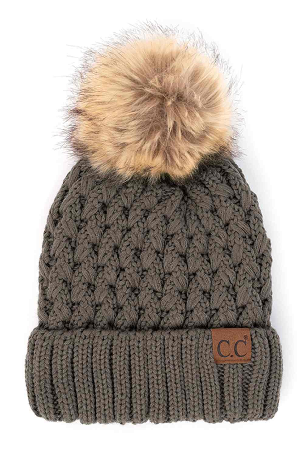 Grey Elevate your winter wardrobe with the C.C Lattice Crossover Stitch Beanie, featuring an intricate lattice pattern and cozy pom detail. Crafted from 100% soft acrylic, this beanie delivers warmth and comfort without the weight. The crossover stitch design adds visual interest while the relaxed fit suits most face shapes. Perfect for layering over your favorite winter looks, this versatile beanie transitions effortlessly from casual outings to outdoor adventures. One size fits most for easy, everyday wea