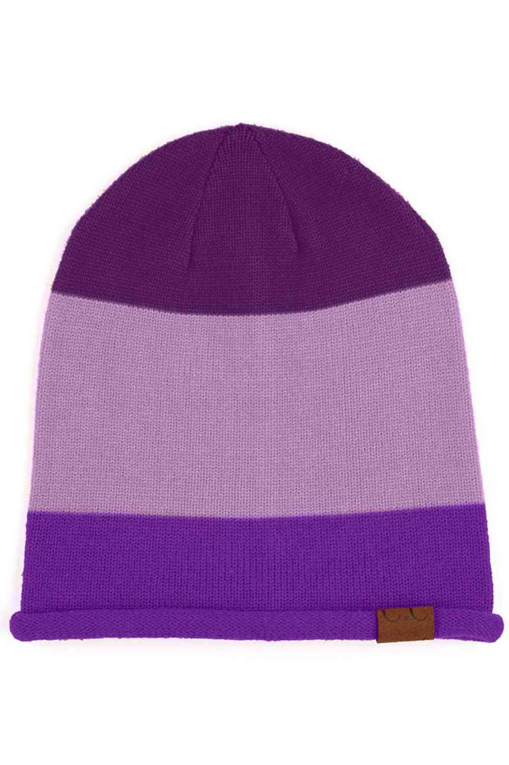 Eggplant Elevate your winter wardrobe with the C.C Colorblock Rolled Cuff Slouchy Beanie, designed for comfort and contemporary style. This relaxed-fit beanie features a striking colorblock design with a rolled cuff that adds visual interest to any outfit. Perfect for chilly days when you want to stay cozy without compromising on style.