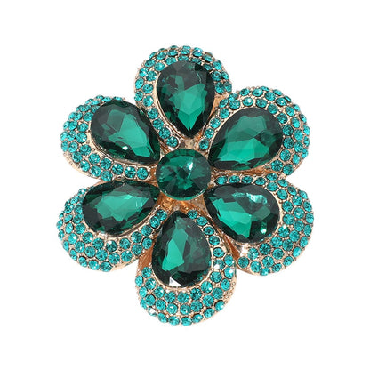 Emerald Crystal Teardrop Cluster Flower Pin Brooch will add sparkle to any outfit. The intricate design and high-quality crystals create a stunning statement piece to enhance any garment. Perfect for weddings, parties, or special occasions. 