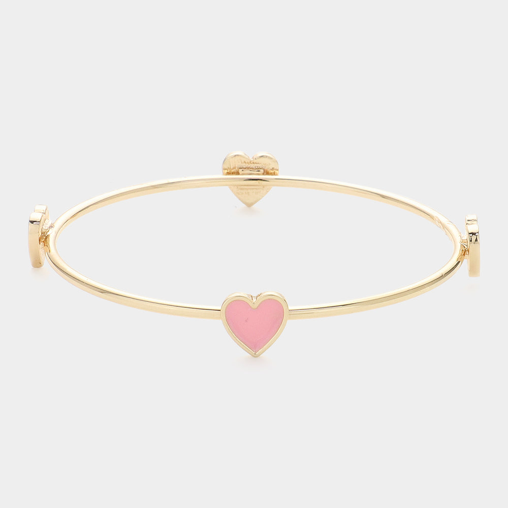 Enamel Heart Pointed Bangle Bracelet features a sleek and modern design that adds a touch of elegance to any outfit. Crafted from high-quality materials, it is durable and long-lasting. Its unique heart shape makes it a perfect gift for that special someone or a meaningful addition to your jewelry collection.
