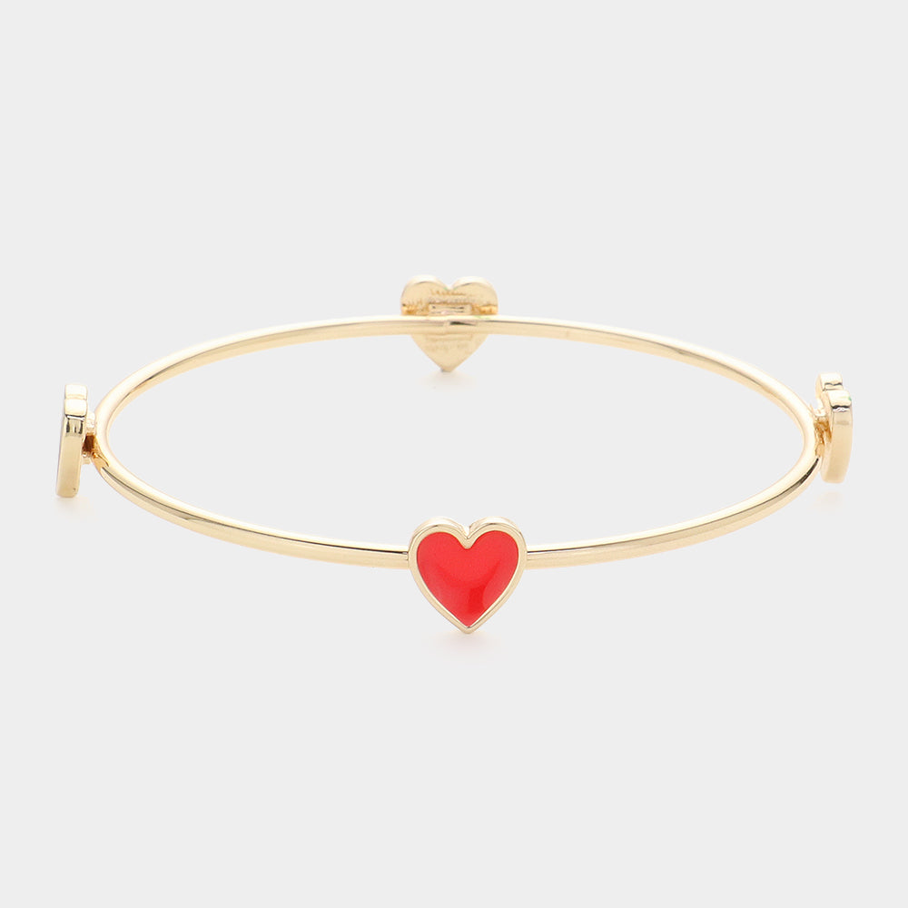 Enamel Heart Pointed Bangle Bracelet features a sleek and modern design that adds a touch of elegance to any outfit. Crafted from high-quality materials, it is durable and long-lasting. Its unique heart shape makes it a perfect gift for that special someone or a meaningful addition to your jewelry collection.