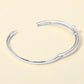 Madeline Love Rhodium Silver Plated CZ Stone Paved T-bar Hinged Bangle Bracelet - Bracelets - extra