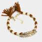 Madeline Love Brown, Gold, Gold Burnished "Dream" Feather Accented Thread Tassel Bracelet - Bracelets
