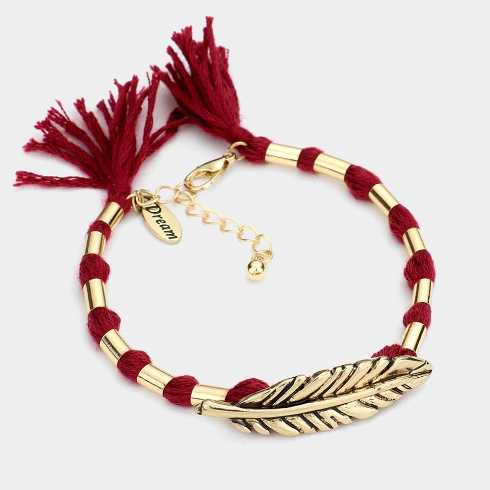 Madeline Love Burgundy, Gold Burnished "Dream" Feather Accented Thread Tassel Bracelet - Bracelets