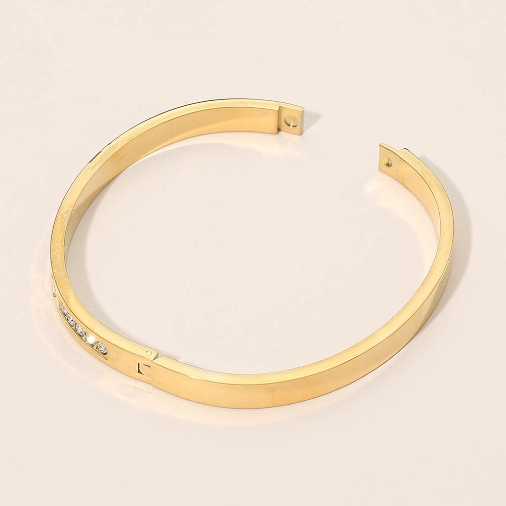 Madeline Love Gold Stainless Steel CZ Accent Quatrefoil Engraved Hinged Bangle Bracelet - Bracelets - extra