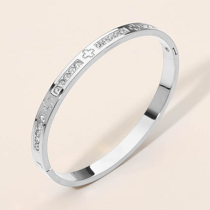 Madeline Love Silver Stainless Steel CZ Accent Quatrefoil Engraved Hinged Bangle Bracelet - Bracelets