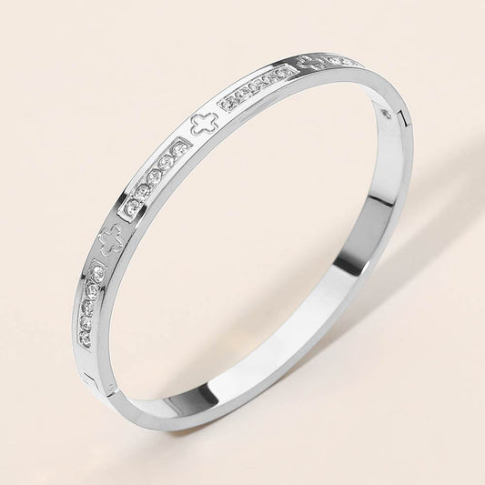 Madeline Love Silver Stainless Steel CZ Accent Quatrefoil Engraved Hinged Bangle Bracelet - Bracelets