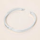 Madeline Love Silver Stainless Steel CZ Accent Quatrefoil Engraved Hinged Bangle Bracelet - Bracelets - extra