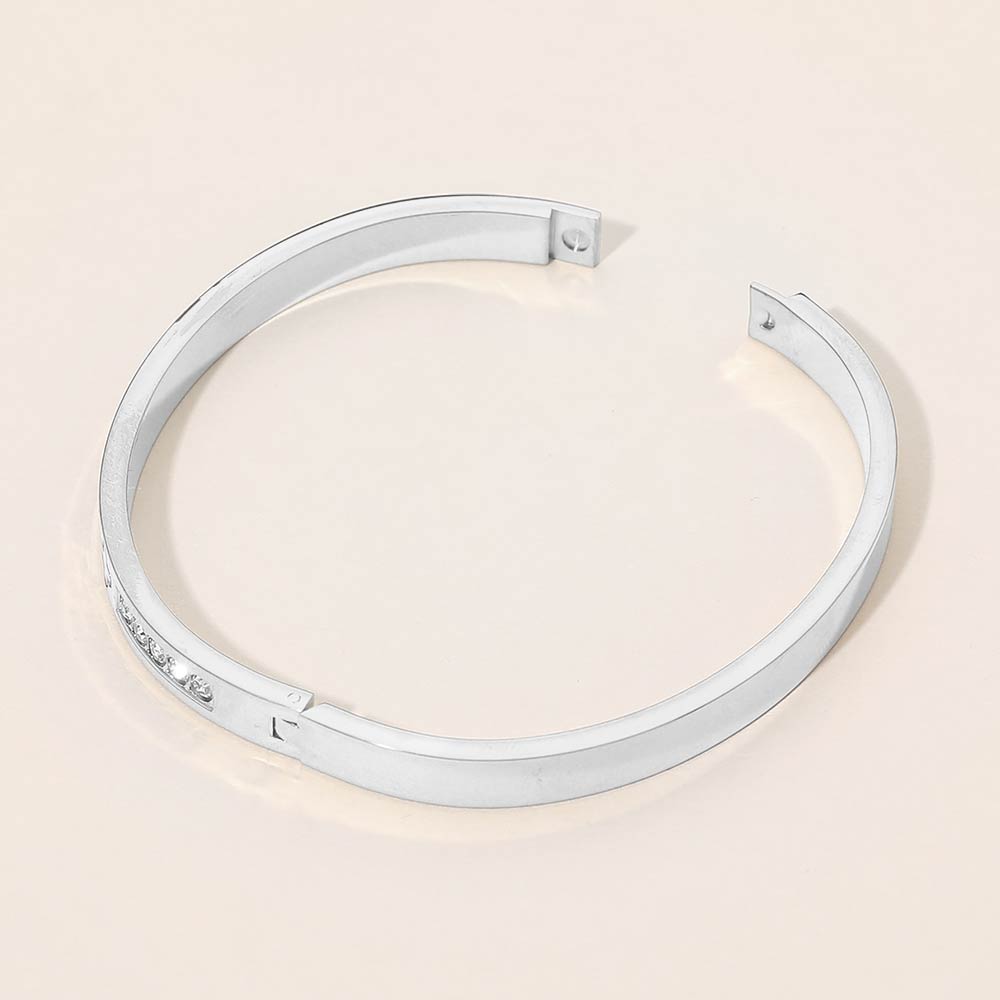 Madeline Love Silver Stainless Steel CZ Accent Quatrefoil Engraved Hinged Bangle Bracelet - Bracelets - extra
