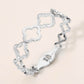 Madeline Love Silver Stainless Steel CZ Pave Accent Open Quatrefoil Link Hinged Bangle Bracelet - Bracelets