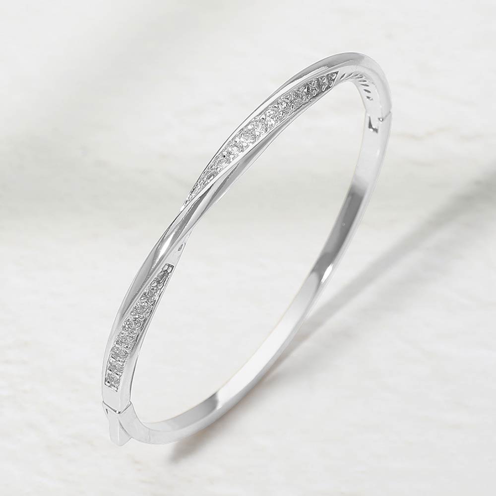 Madeline Love Clear, Silver Rhodium Plated CZ Pave Twist Hinged Bangle Bracelet - Bracelets
