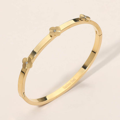 Madeline Love Gold Stainless Steel CZ Center Quatrefoil Station Hinged Bangle Bracelet - Bracelets
