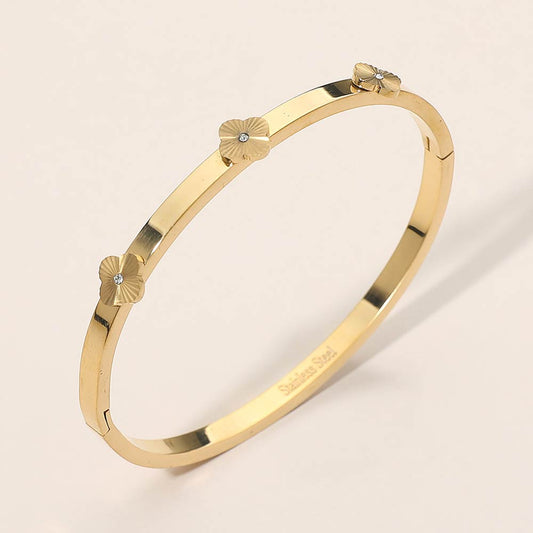 Madeline Love Gold Stainless Steel CZ Center Quatrefoil Station Hinged Bangle Bracelet - Bracelets