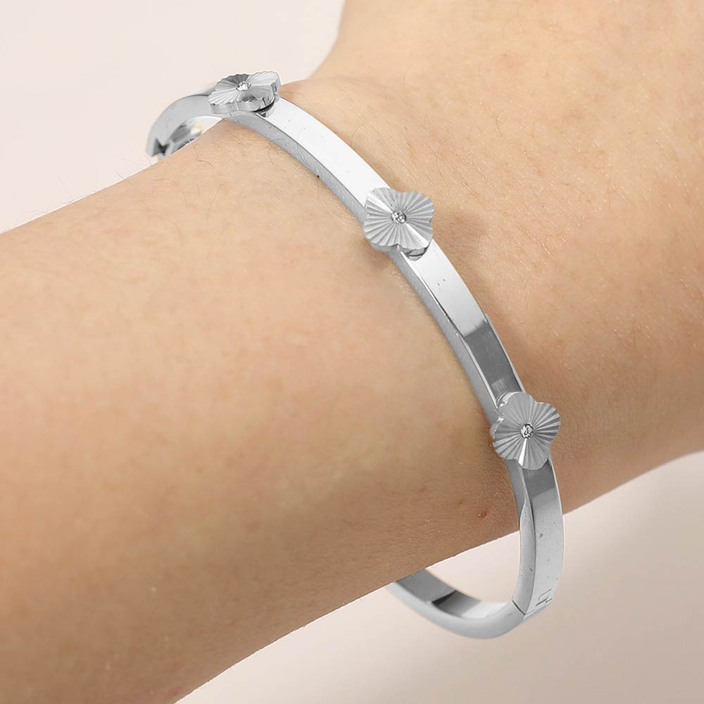 Madeline Love Silver Stainless Steel CZ Center Quatrefoil Station Hinged Bangle Bracelet - Bracelets
