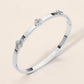 Madeline Love Silver Stainless Steel CZ Center Quatrefoil Station Hinged Bangle Bracelet - Bracelets - desc